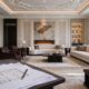 تصميم داخلي فاخر يوضح تحول المخططات الهندسية إلى واقع ملموس في غرفة معيشة